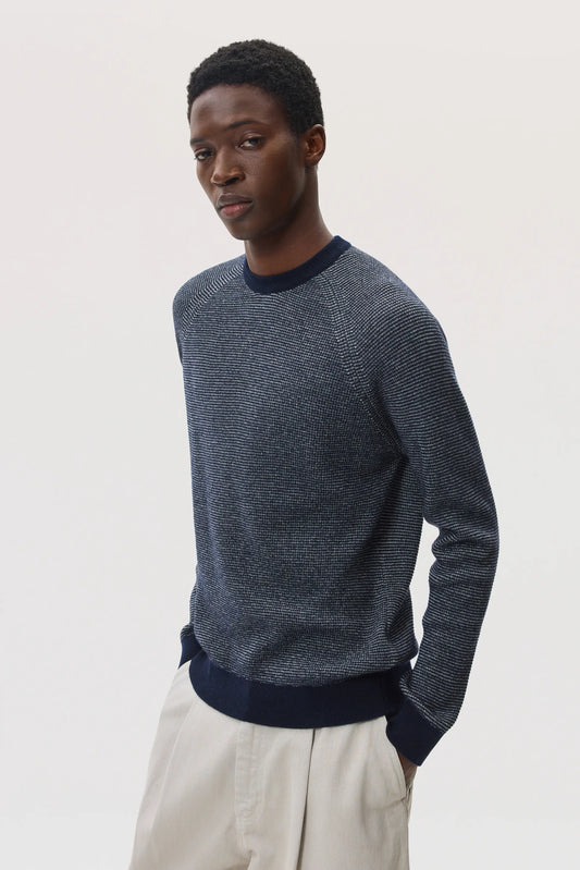 Johnstons of Elgin SS25 Men's Knitwear Navy & Light Grey Featherlight Cashmere Waffle Stitch Jumper on a pale backdrop 
 KAP05441Q25129