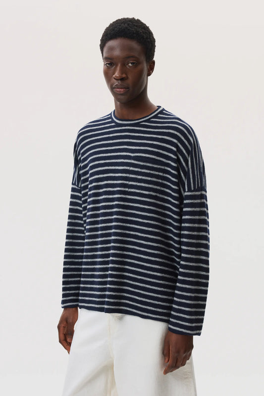 Johnstons of Elgin SS25 Men's Knitwear Navy & Light Grey Cashmere Jersey Stripe Oversized T-Shirt worn with white trousers KAP05442Q25133