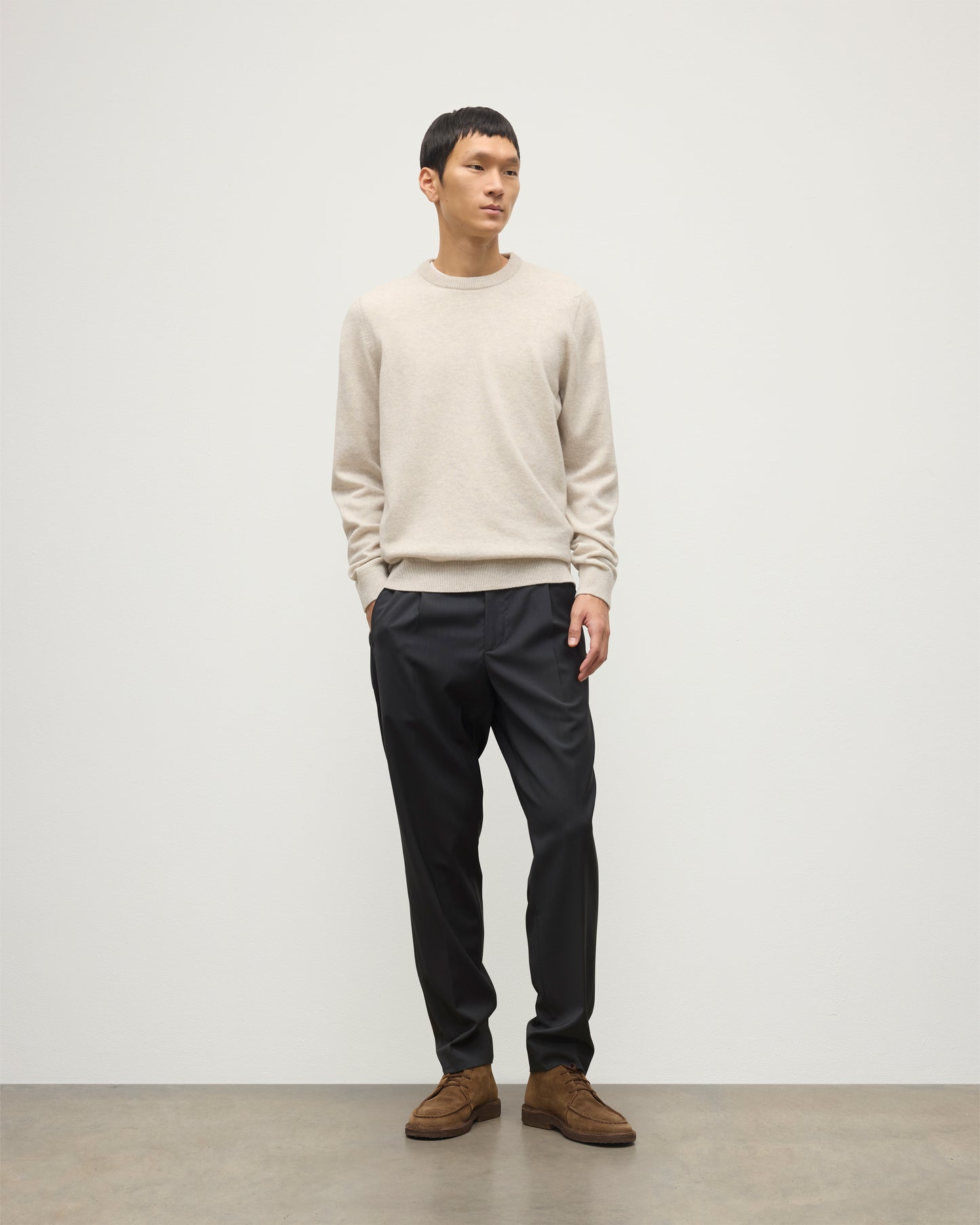 MENS RORY CREW CLASSIC JUMPER NATURAL 100% CASHMERE, BY JOHNSTONS OF ELGIN, WORN WITH GREY TROUSERS AND BROWN LAOFERS KAP05471HA0402