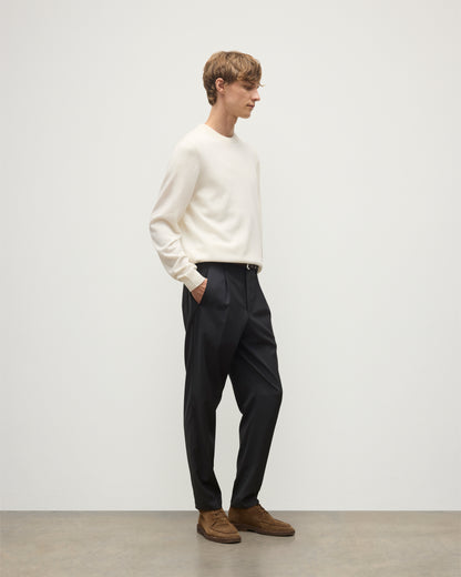 MODEL WEARS JOHNSTONS OF ELGIN MENS RORY CREW CLASSIC JUMPER WHITE 100% CASHMERE WITH GREY TROUSERS AND BROWN BELT AND SHOES KAP05471SA0606