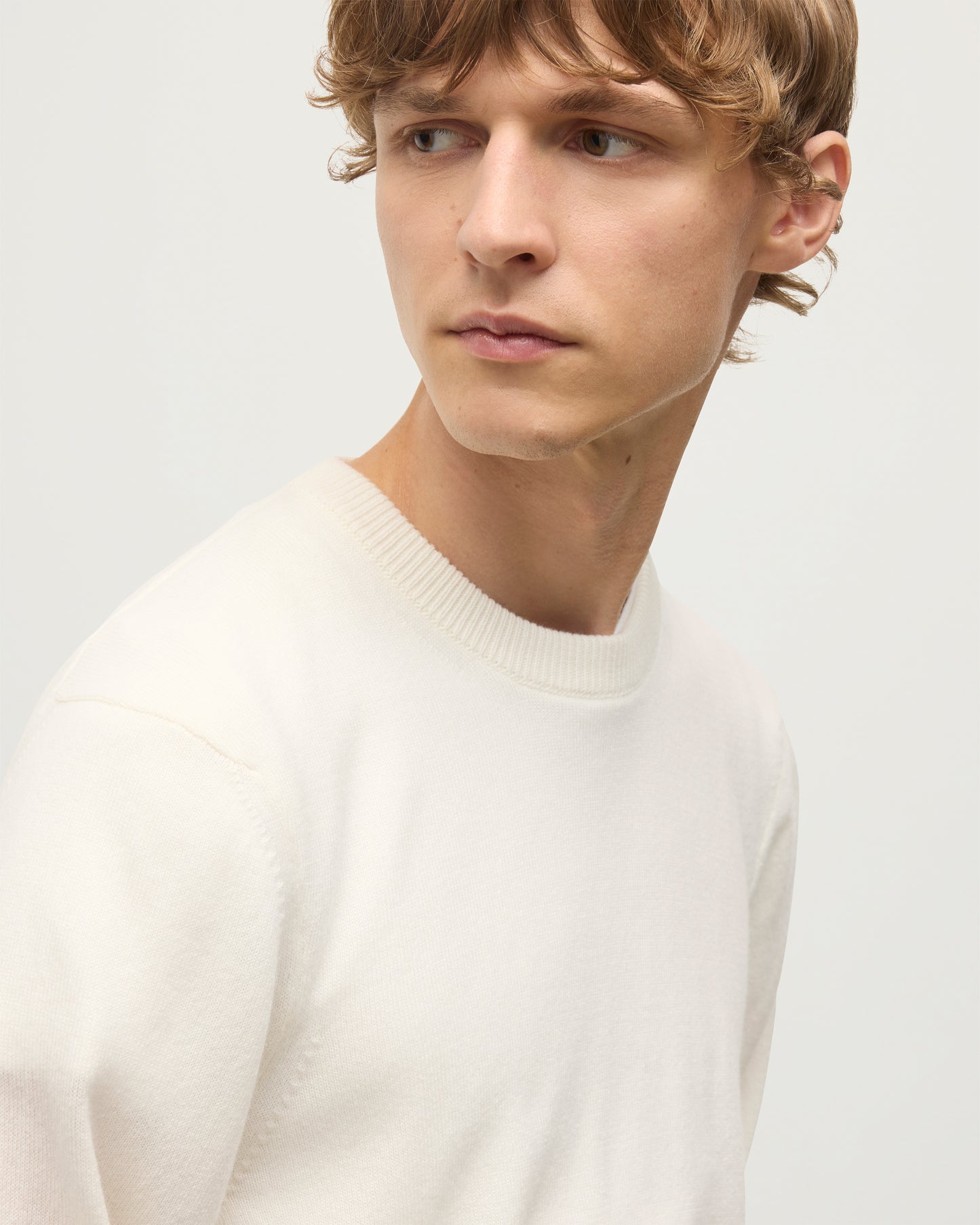 MODEL WEARS JOHNSTONS OF ELGIN MENS RORY CREW CLASSIC JUMPER WHITE 100% CASHMERE   KAP05471SA0606