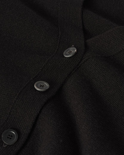 Model wears Johnstons of Elgin  Women's Knitwear Black Milano Stitch Black Cashmere Cardigan over a white shirt Front View KAP05489SA7210