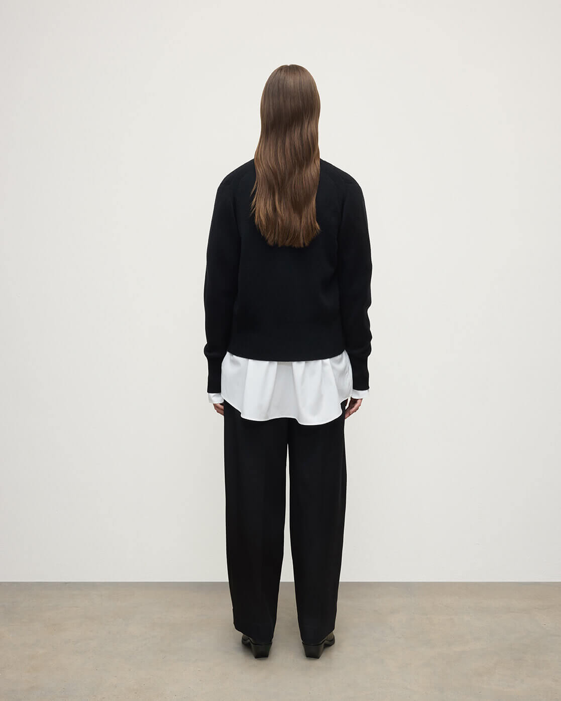 Model wears Johnstons of Elgin  Women's Knitwear Black Milano Stitch Black Cashmere Cardigan over a white shirt Front View KAP05489SA7210