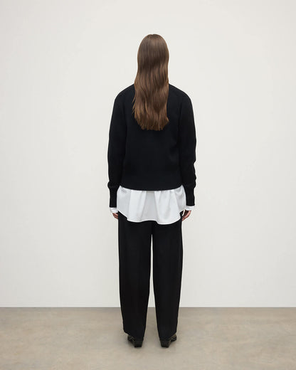 Model wears Johnstons of Elgin  Women's Knitwear Black Milano Stitch Black Cashmere Cardigan over a white shirt Front View KAP05489SA7210