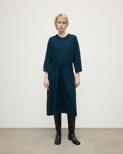 Model wears Johnstons of Elgin AW25 Women's Knitwear Bottle Green Tie-Waist Cashmere Green Jumper Dress Front View  KAP05490SC7341