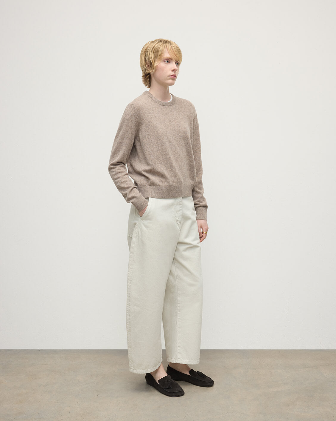 model wears Johnstons of Elgin AW25 Women's Knitwear Ash Classic Cashmere Brown Round Neck Jumper Side KAP05572HB4334