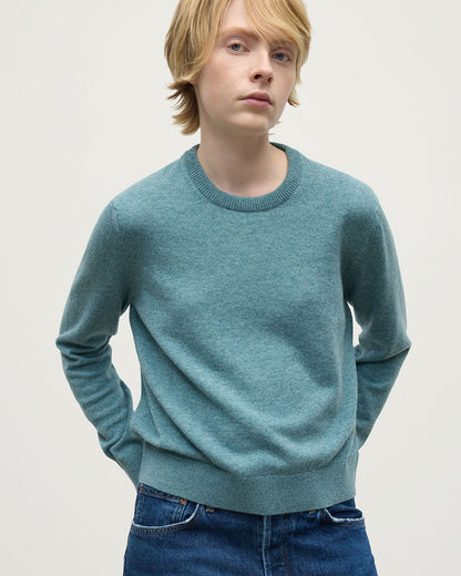 Model wearing Johnstons of Elgin AW25 Women's Knitwear Seascape Classic Cashmere Green Round Neck Jumper Close Up  KAP05572HC0038