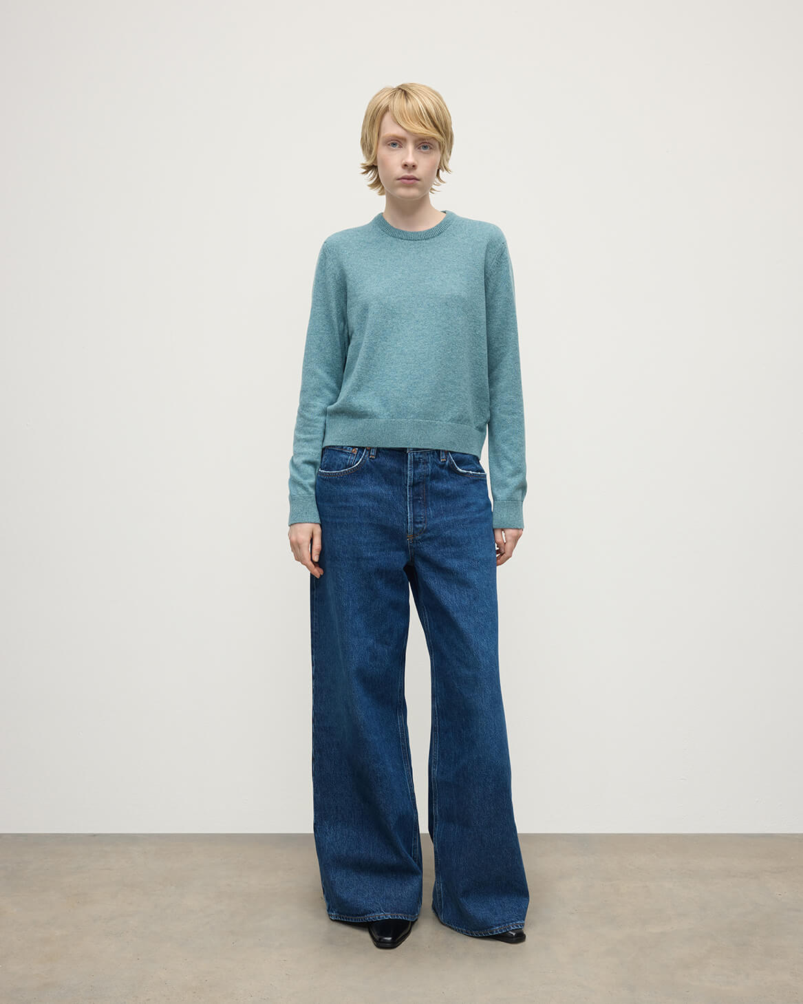 Model wearing Johnstons of Elgin AW25 Women's Knitwear Seascape Classic Cashmere Green Round Neck Jumper Front View  KAP05572HC0038