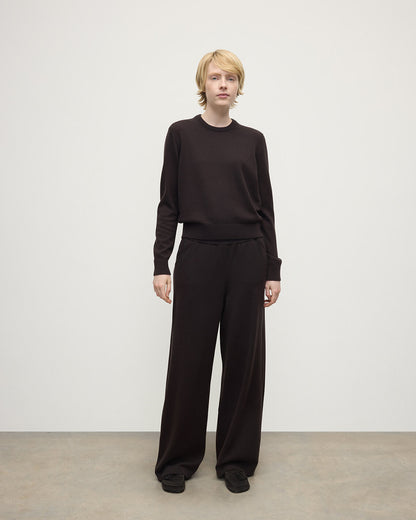 Model wearing Johnstons of Elgin AW25 Women's Knitwear Molasses Classic Cashmere Brown Round Neck Jumper Front View KAP05572SB7290