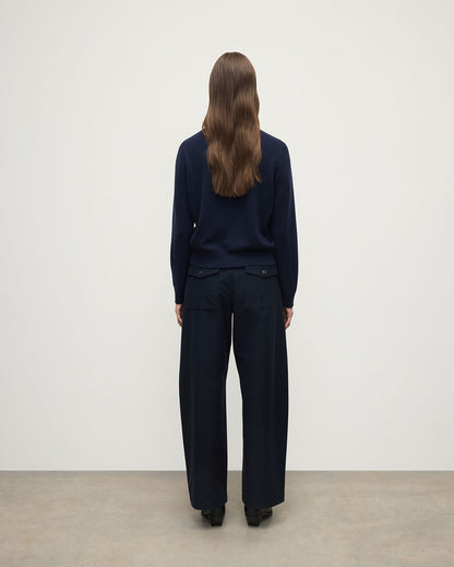 Model wearing Johnstons of Elgin AW25 Women's Knitwear Dark Navy Classic Cashmere Navy Round Neck Jumper back View  KAP05572SD7666