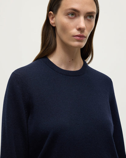 Model wearing Johnstons of Elgin AW25 Women's Knitwear Dark Navy Classic Cashmere Navy Round Neck Jumper close up  KAP05572SD7666