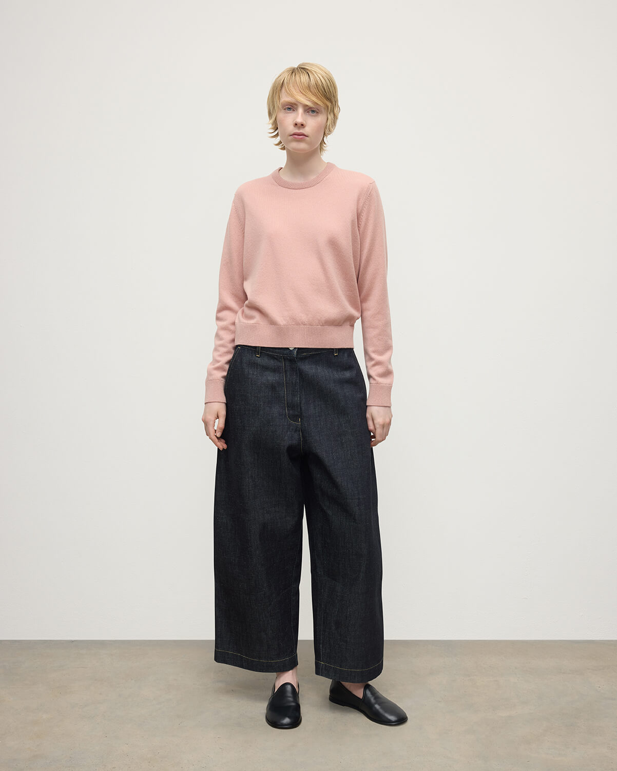 Model wears Johnstons of Elgin AW25 Women's Knitwear Nude Classic Cashmere Pink Round Neck Jumper Front View KAP05572SE0740