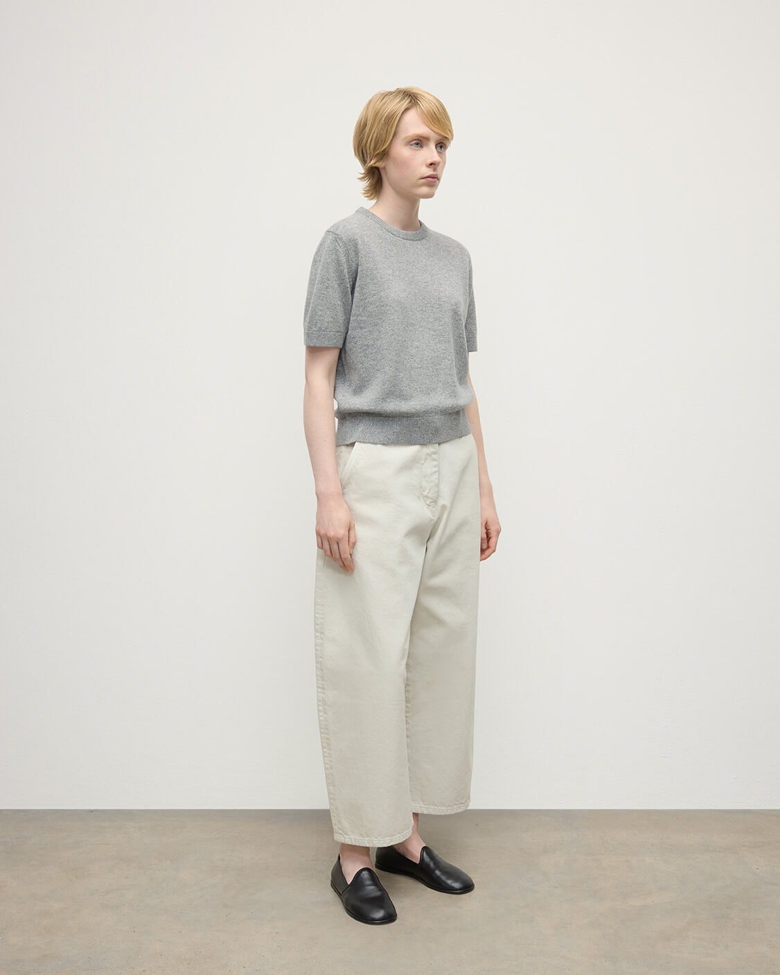 Model wearing Johnstons of Elgin AW25 Women's Knitwear Light Grey Classic Cashmere Grey T-shirt Side KAP05574HA0308