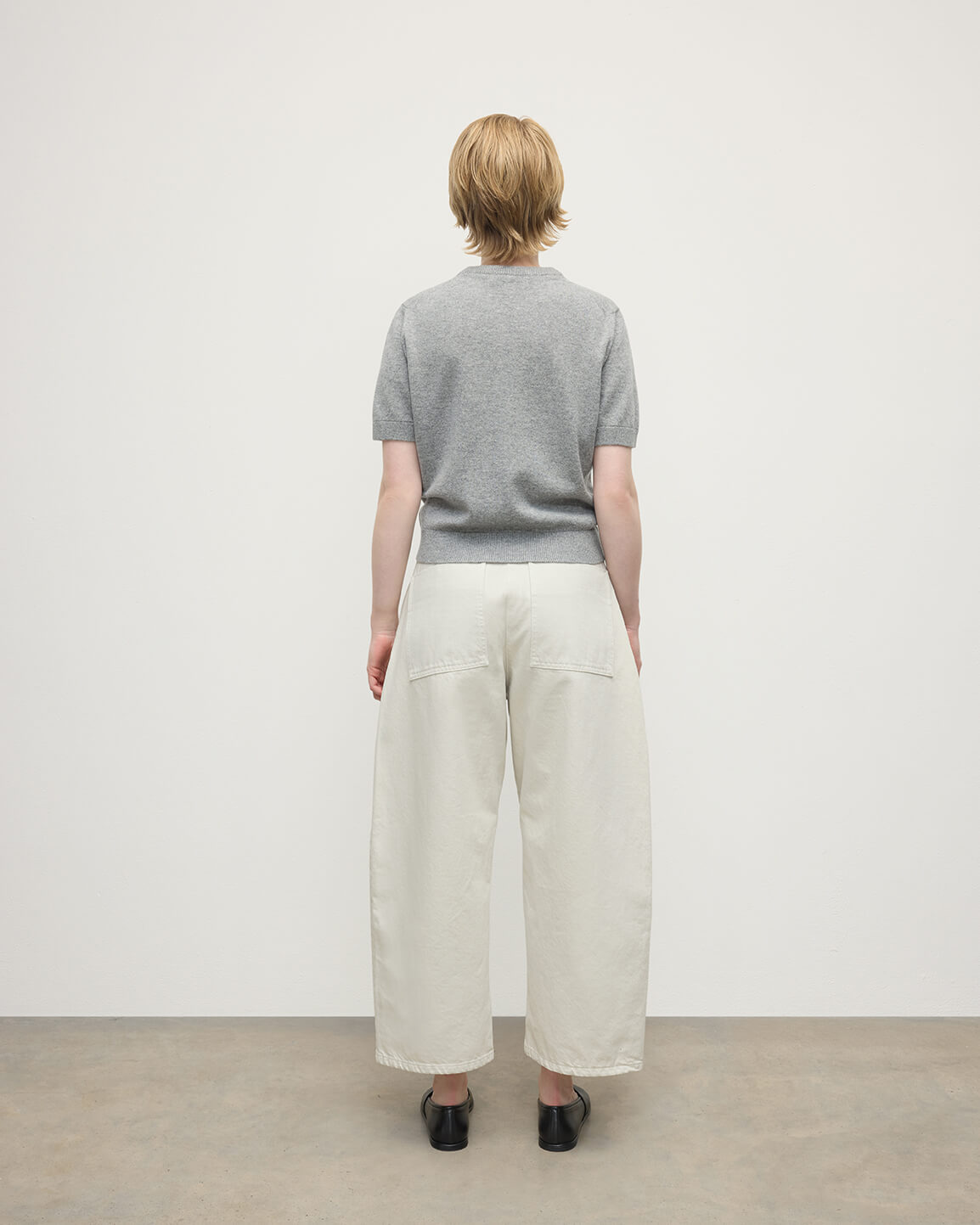 Model wearing Johnstons of Elgin AW25 Women's Knitwear Light Grey Classic Cashmere Grey T-shirt Back KAP05574HA0308