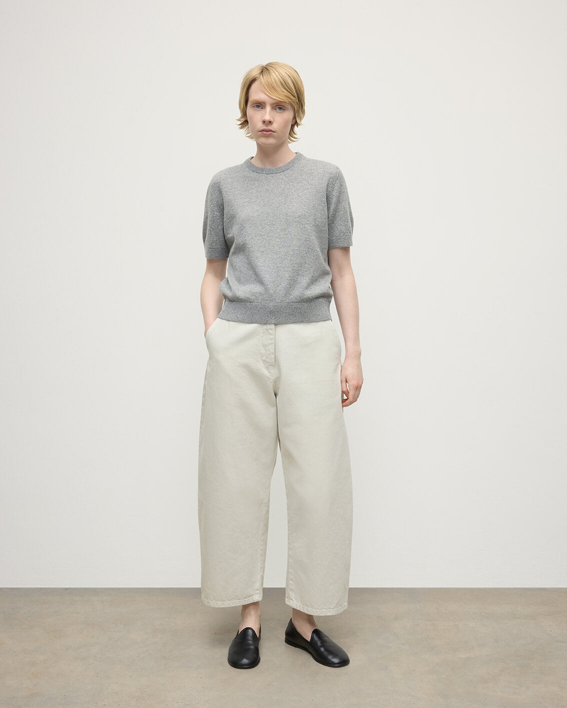 Model wearing Johnstons of Elgin AW25 Women's Knitwear Light Grey Classic Cashmere Grey T-shirt Front KAP05574HA0308