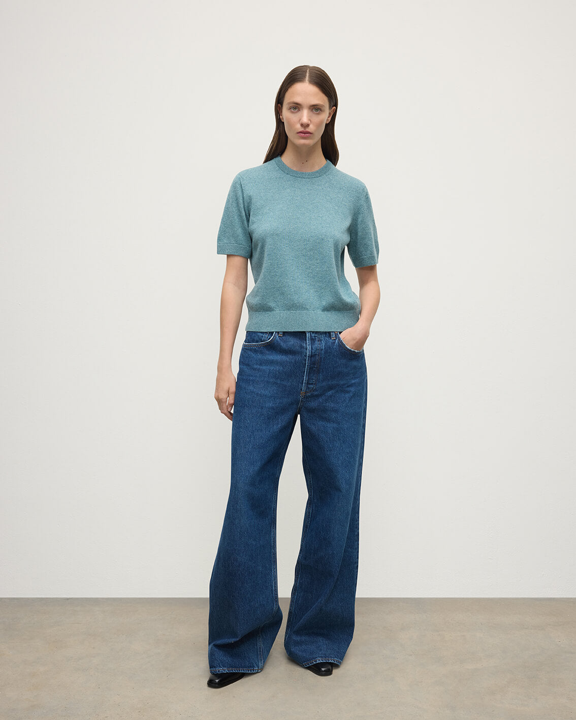 Model wears Johnstons of Elgin AW25 Women's Knitwear Seascape Classic Cashmere Green T-shirt Front View KAP05574HC0038