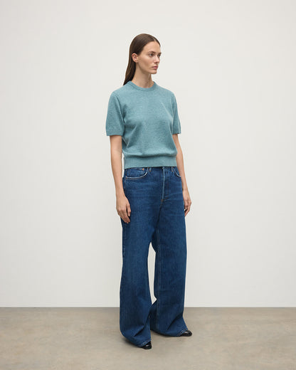 Model wears Johnstons of Elgin AW25 Women's Knitwear Seascape Classic Cashmere Green T-shirt Side View KAP05574HC0038