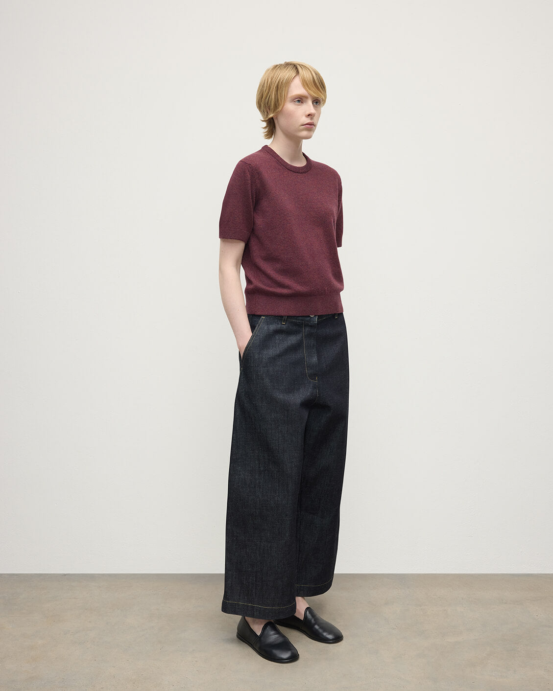 Model wears Johnstons of Elgin AW25 Women's Knitwear Damson Classic Cashmere Purple T-shirt Side KAP05574HE7064