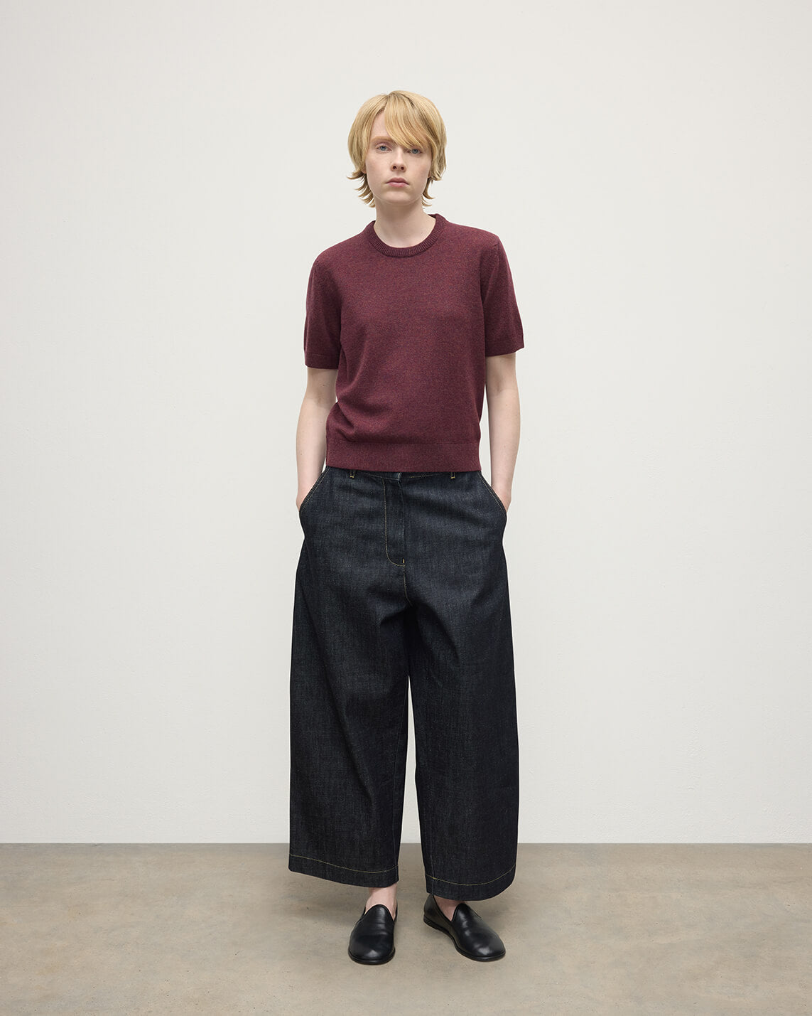 Model wears Johnstons of Elgin AW25 Women's Knitwear Damson Classic Cashmere Purple T-shirt Front KAP05574HE7064