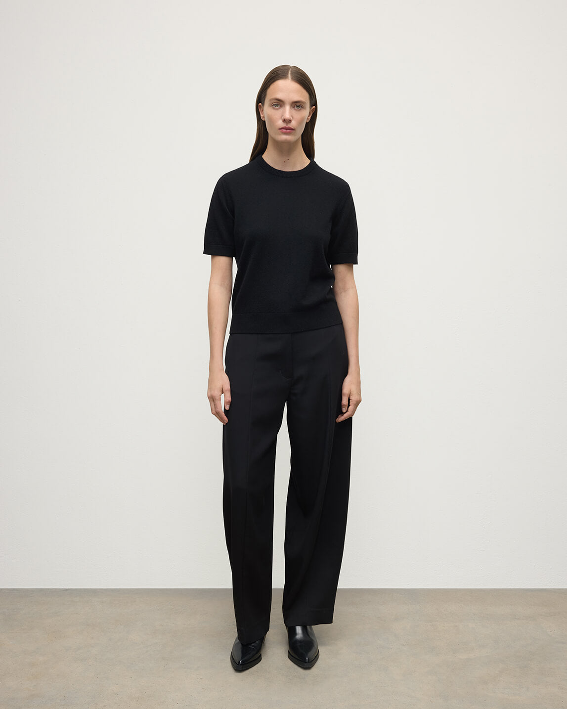 Model wearing Johnstons of Elgin AW25 Women's Knitwear Black Classic Cashmere Black T-shirt Front KAP05574SA7210