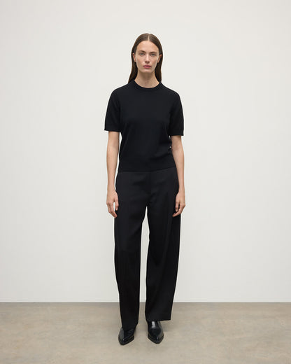 Model wearing Johnstons of Elgin AW25 Women's Knitwear Black Classic Cashmere Black T-shirt Front KAP05574SA7210