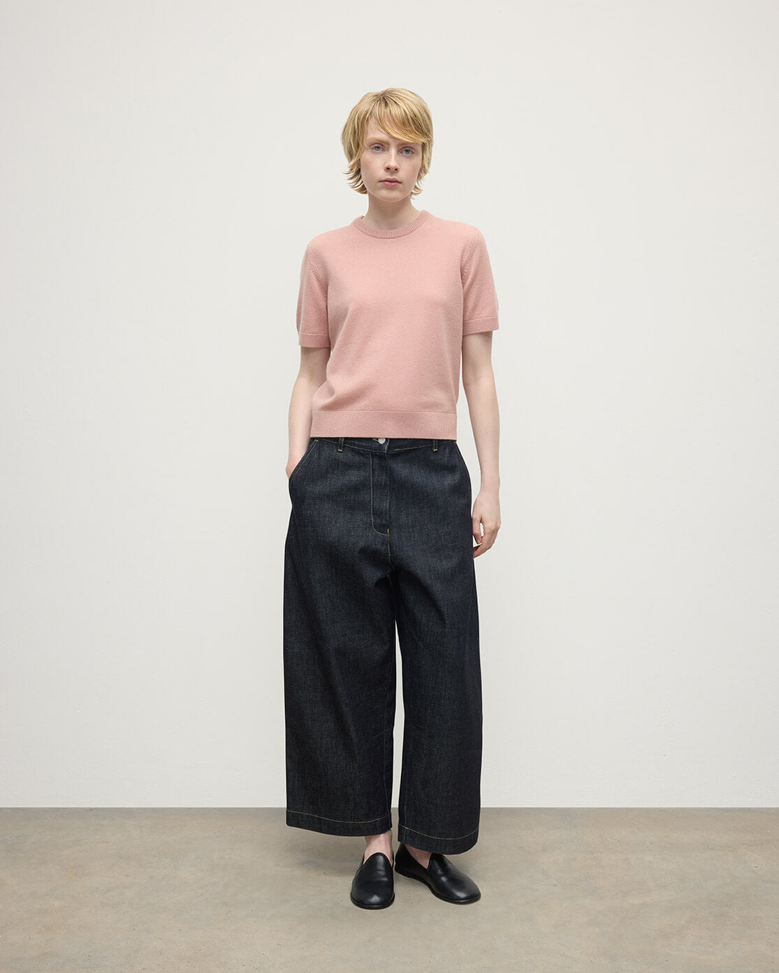 Model wearing Johnstons of Elgin AW25 Women's Knitwear Nude Classic Cashmere Pink T-shirt Front KAP05574SE0740