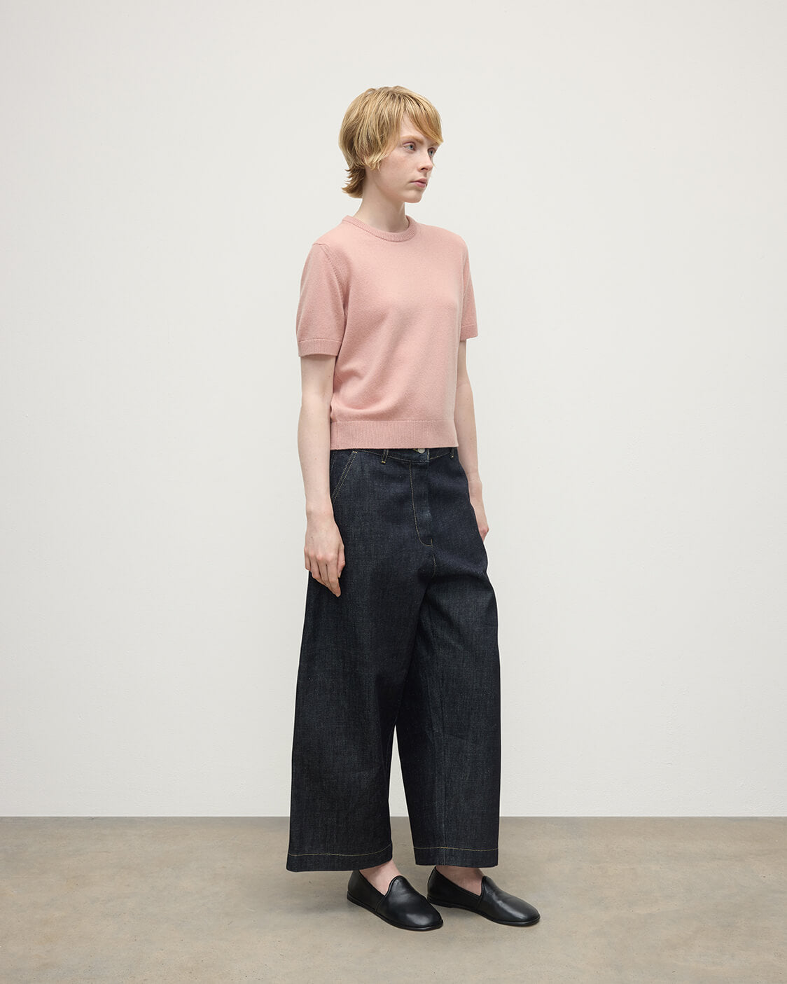 Model wearing Johnstons of Elgin AW25 Women's Knitwear Nude Classic Cashmere Pink T-shirt Side KAP05574SE0740