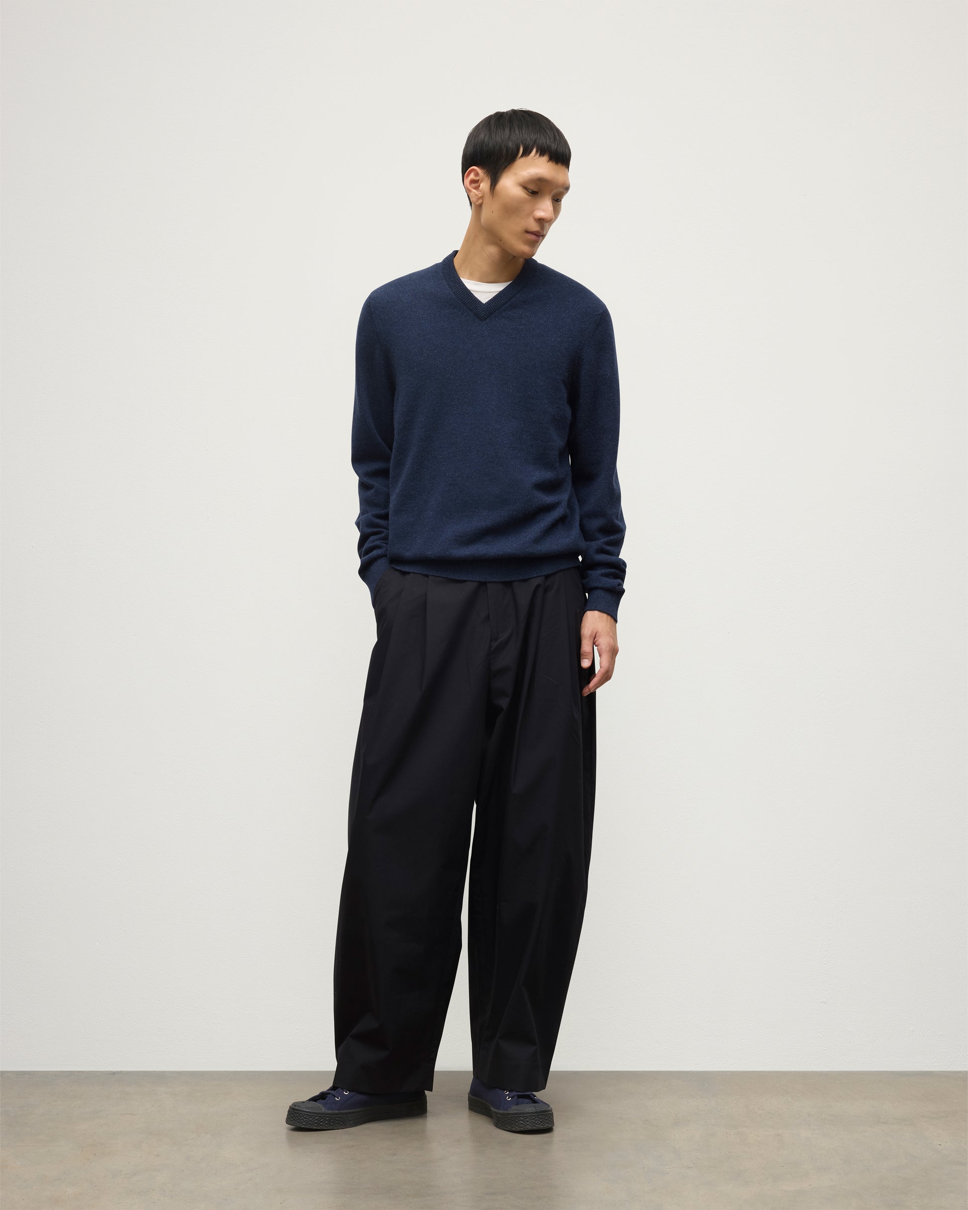 MODEL WEARS JOHNSTONS OF  ELGIN MENS RORY VEE NECK CLASSIC JUMPER 100% CASHMERE WITH NAVY TROUSERS KAP05594HD7350