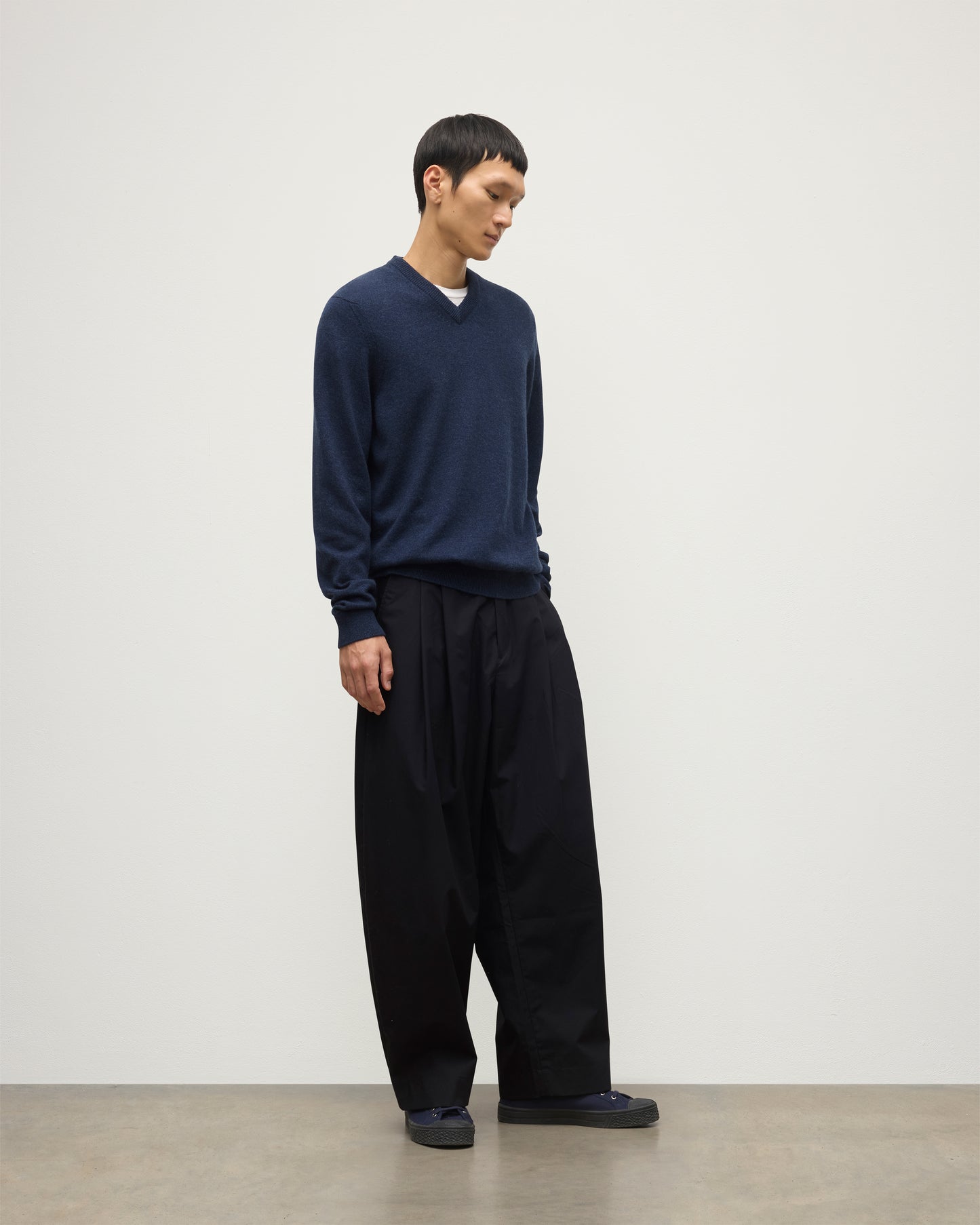 MODEL WEARS JOHNSTONS OF  ELGIN MENS RORY VEE NECK CLASSIC JUMPER 100% CASHMERE WITH NAVY TROUSERS KAP05594HD7350