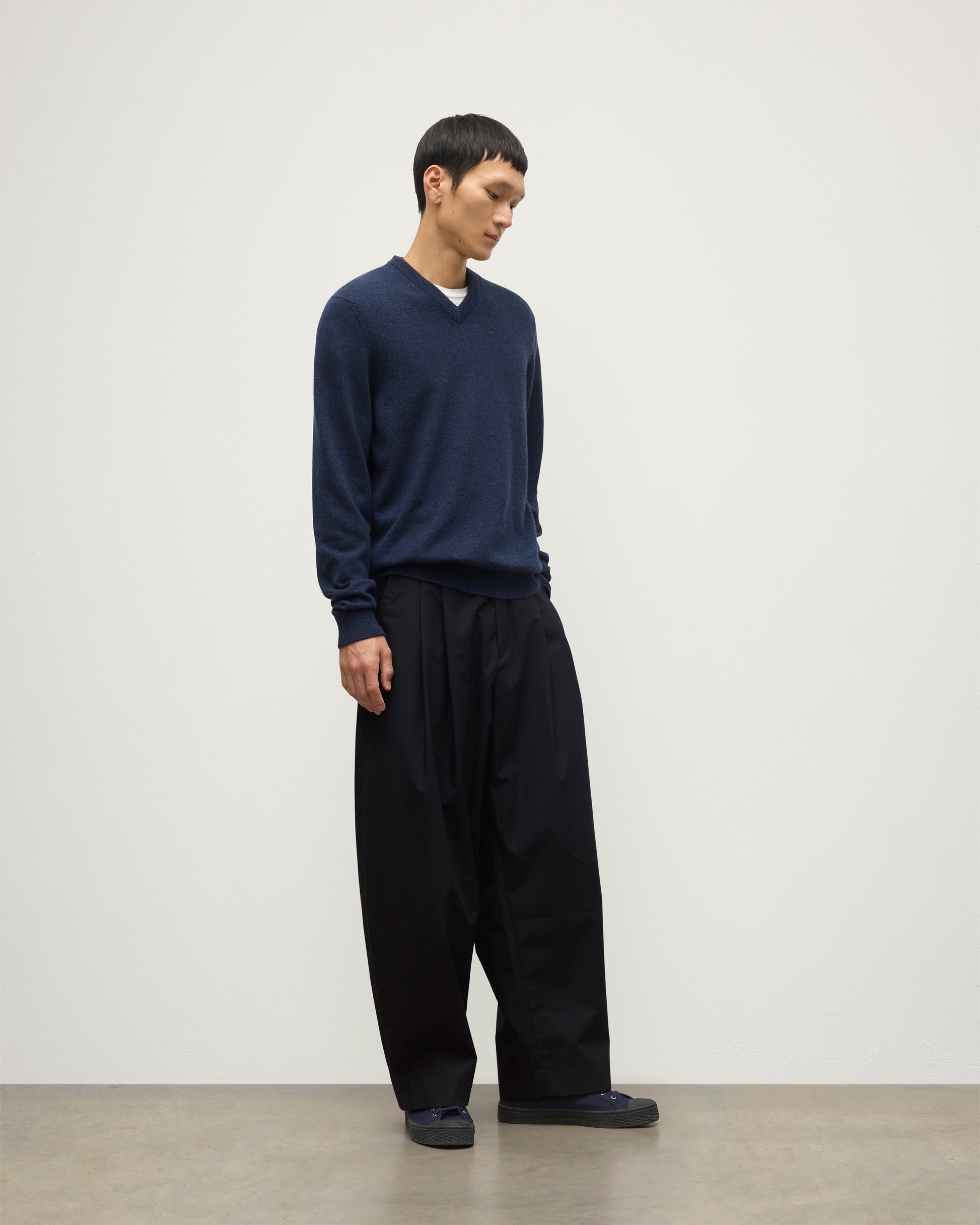 MODEL WEARS JOHNSTONS OF  ELGIN MENS RORY VEE NECK CLASSIC JUMPER 100% CASHMERE WITH NAVY TROUSERS KAP05594HD7350