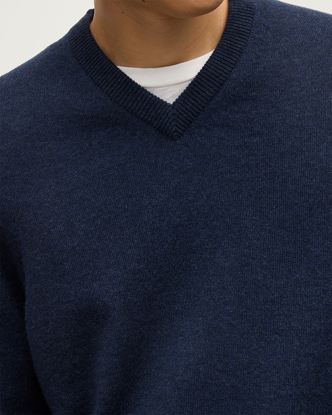 MODEL WEARS JOHNSTONS OF  ELGIN MENS RORY VEE NECK CLASSIC JUMPER 100% CASHMERE  KAP05594HD7350