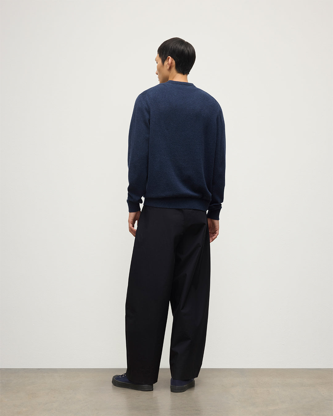 MODEL WEARS JOHNSTONS OF  ELGIN MENS RORY VEE NECK CLASSIC JUMPER 100% CASHMERE WITH NAVY TROUSERS KAP05594HD7350