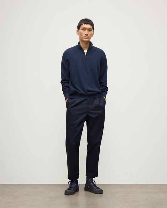 MODEL WEARS JOHNSTONS OF ELGIN MENS RORY CLASSIC HALF ZIP CLASSIC SWEATER 100% CASHMERE  OVER A WHITE T-SHURT WITH NAVY TROUSERS KAP05695HD7350