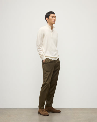 MODEL WEARS JOHNSTONS OF ELGIN MENS RORY CLASSIC HALF ZIP CLASSIC SWEATER 100% CASHMERE OVER A WHITE T-SHIRT WITH OLIVE GREEN TROUSERS KAP05695SA0606