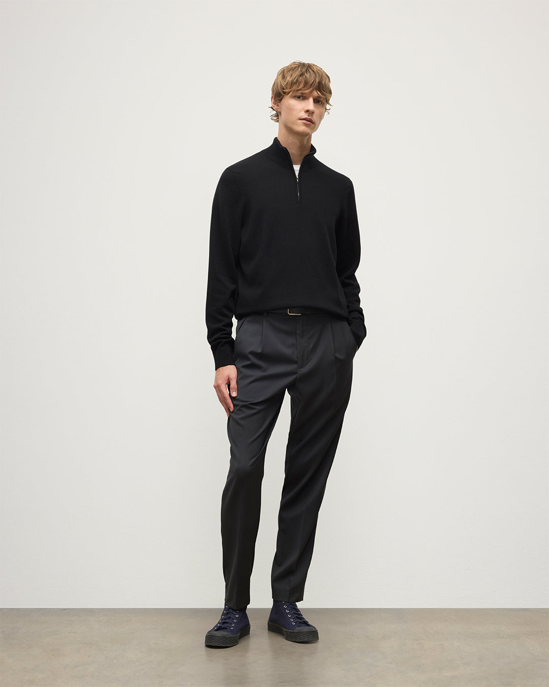 Model wearing Johnstons of Elgin AW25 Men's Knitwear Black Classic Cashmere Black Zip Neck Jumper KAP05695SA7210