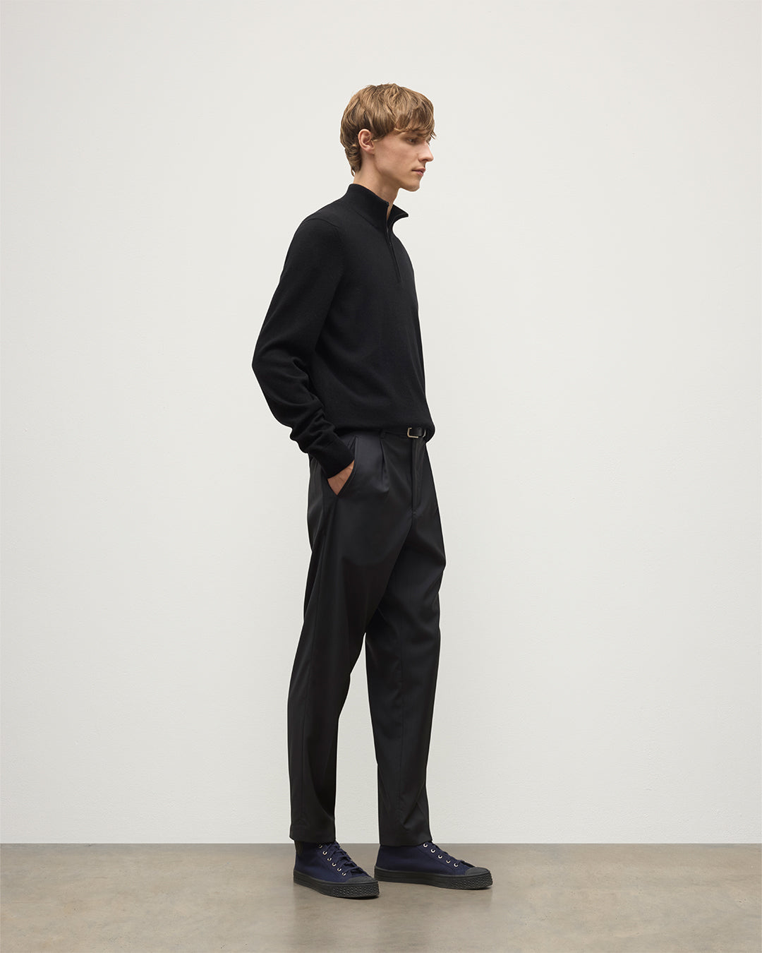 Model wears Johnstons of Elgin Men's Knitwear Rory Black Classic Cashmere Black Zip Neck Jumper KAP05695SA7210