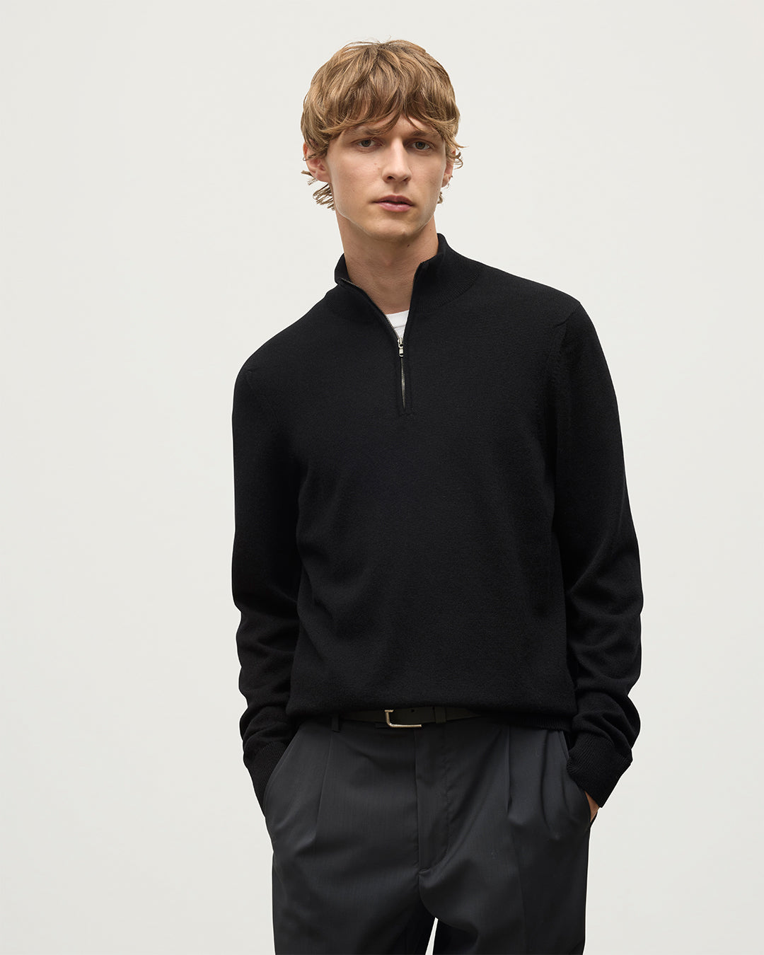 Model wears Johnstons of Elgin Men's Knitwear Rory Black Classic Cashmere Black Zip Neck Jumper KAP05695SA7210