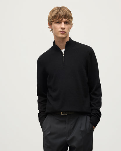 Model wears Johnstons of Elgin Men's Knitwear Rory Black Classic Cashmere Black Zip Neck Jumper KAP05695SA7210