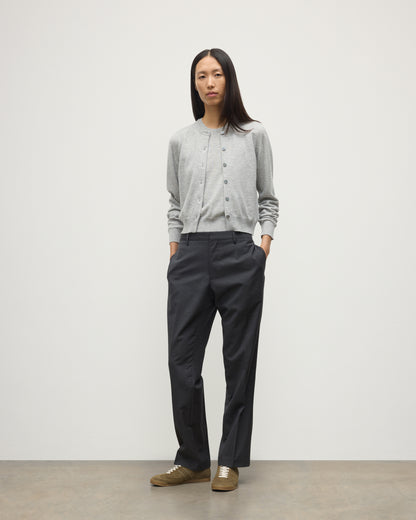 MODEL WEARS JOHNSTONS OF ELGIN WOMENS IRIS CLASSIC CREW CARDIGAN GREY WITH GREY TROUSERS AND TRAINERS  100% CASHMERE KAP05704HA0399