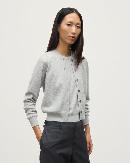 MODEL WEARS JOHNSTONS OF ELGIN WOMENS IRIS CLASSIC CREW CARDIGAN GREY 100% CASHMERE KAP05704HA0399