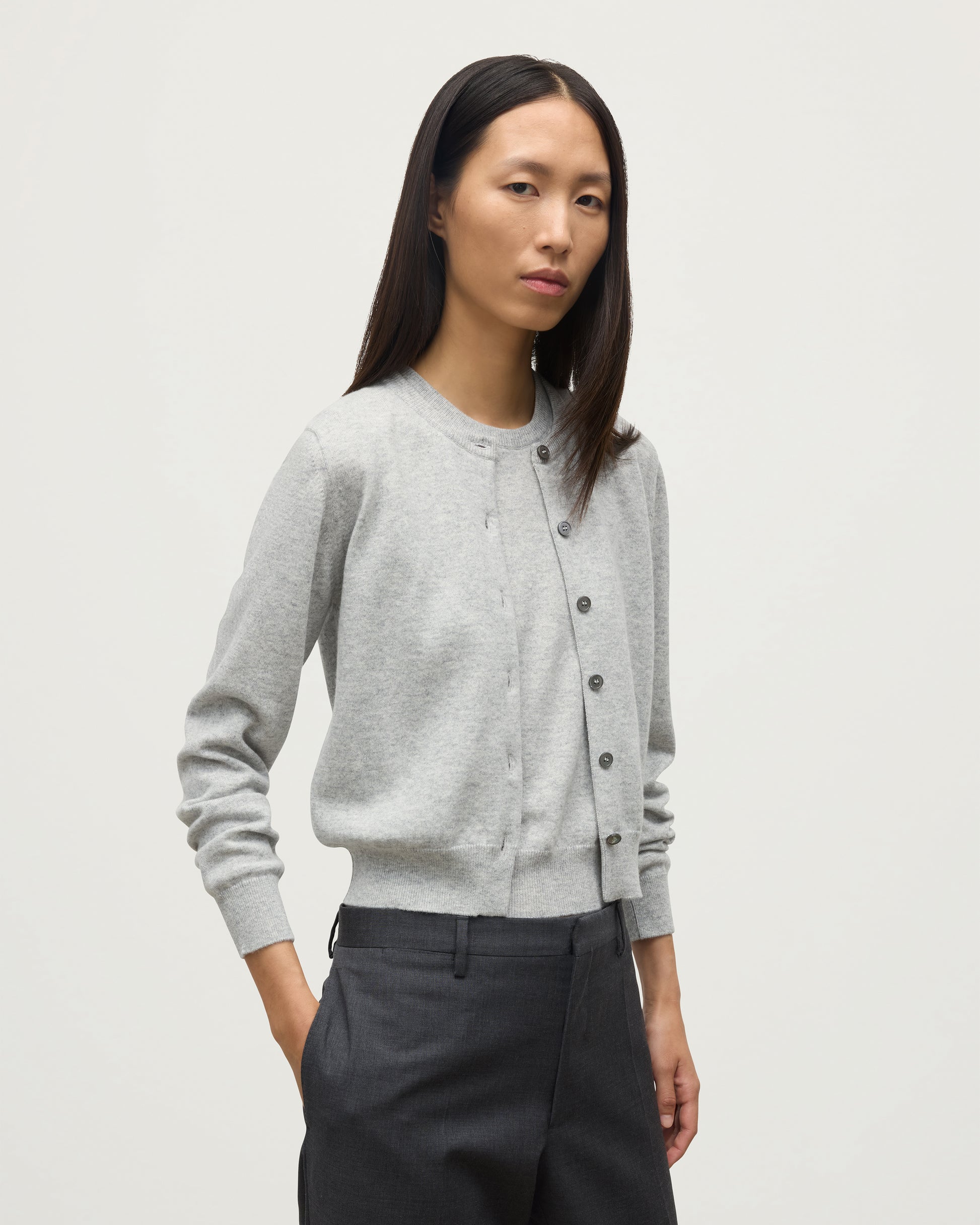 MODEL WEARS JOHNSTONS OF ELGIN WOMENS IRIS CLASSIC CREW CARDIGAN GREY 100% CASHMERE KAP05704HA0399