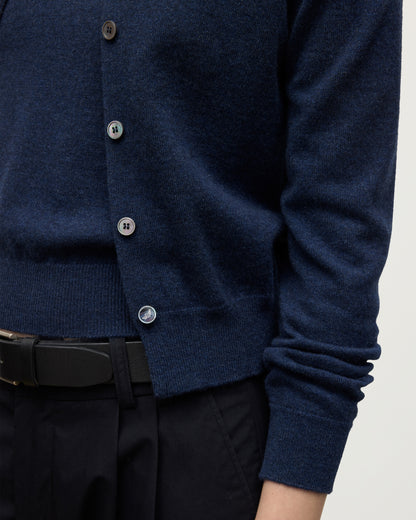 MODEL WEARING JOHNSTONS OF ELGIN WOMENS IRIS CLASSIC CREW CARDIGAN NAVY 100% CASHMERE, OVER A MATCHING SLEEVELESS TANK KAP05704HD7350