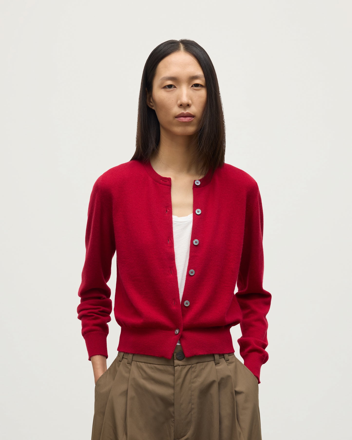 MODEL WEARS JOHNSTONS OF ELGIN WOMENS IRIS CLASSIC CREW CARDIGAN RED 100% CASHMERE KAP05704SE5325