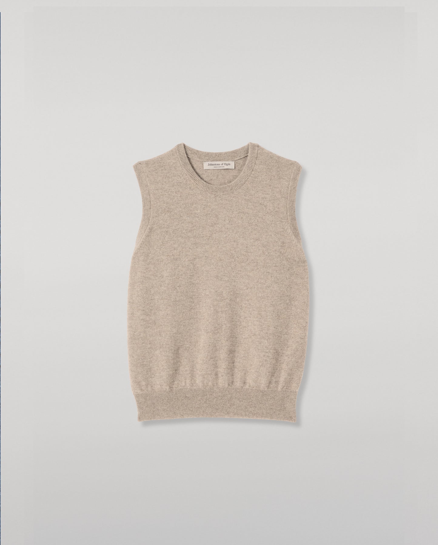 JOHNSTONS OF ELGIN IRIS SLEEVELESS CREW PETITE CASHMERE ROUND NECK TANK - 2 PLY LIGHT BROWN 100% CASHMERE WITH CLANLASS RED CHECK SHIRT TIED AROUND WAIST KAP05705HB4447