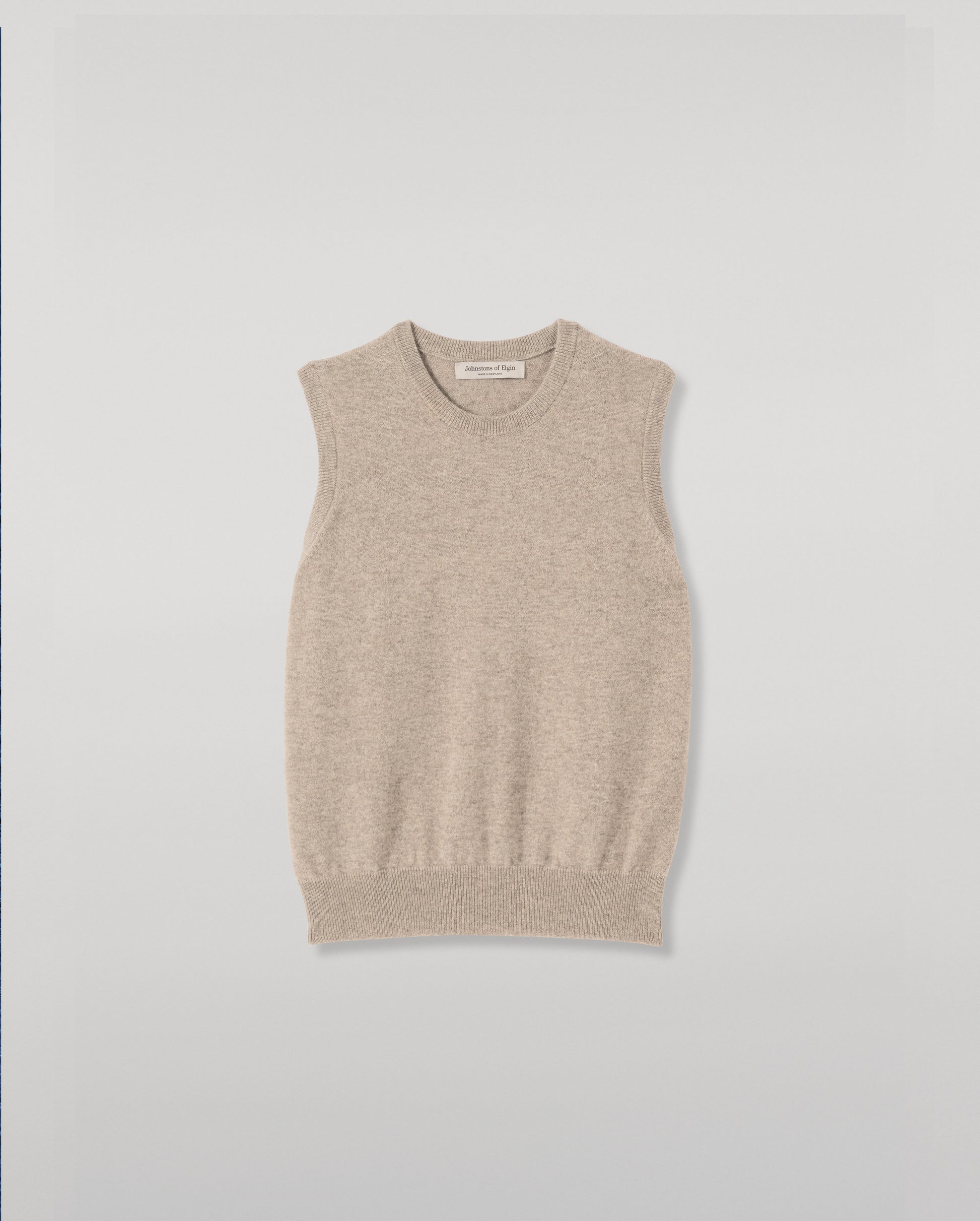 JOHNSTONS OF ELGIN IRIS SLEEVELESS CREW PETITE CASHMERE ROUND NECK TANK - 2 PLY LIGHT BROWN 100% CASHMERE WITH CLANLASS RED CHECK SHIRT TIED AROUND WAIST KAP05705HB4447