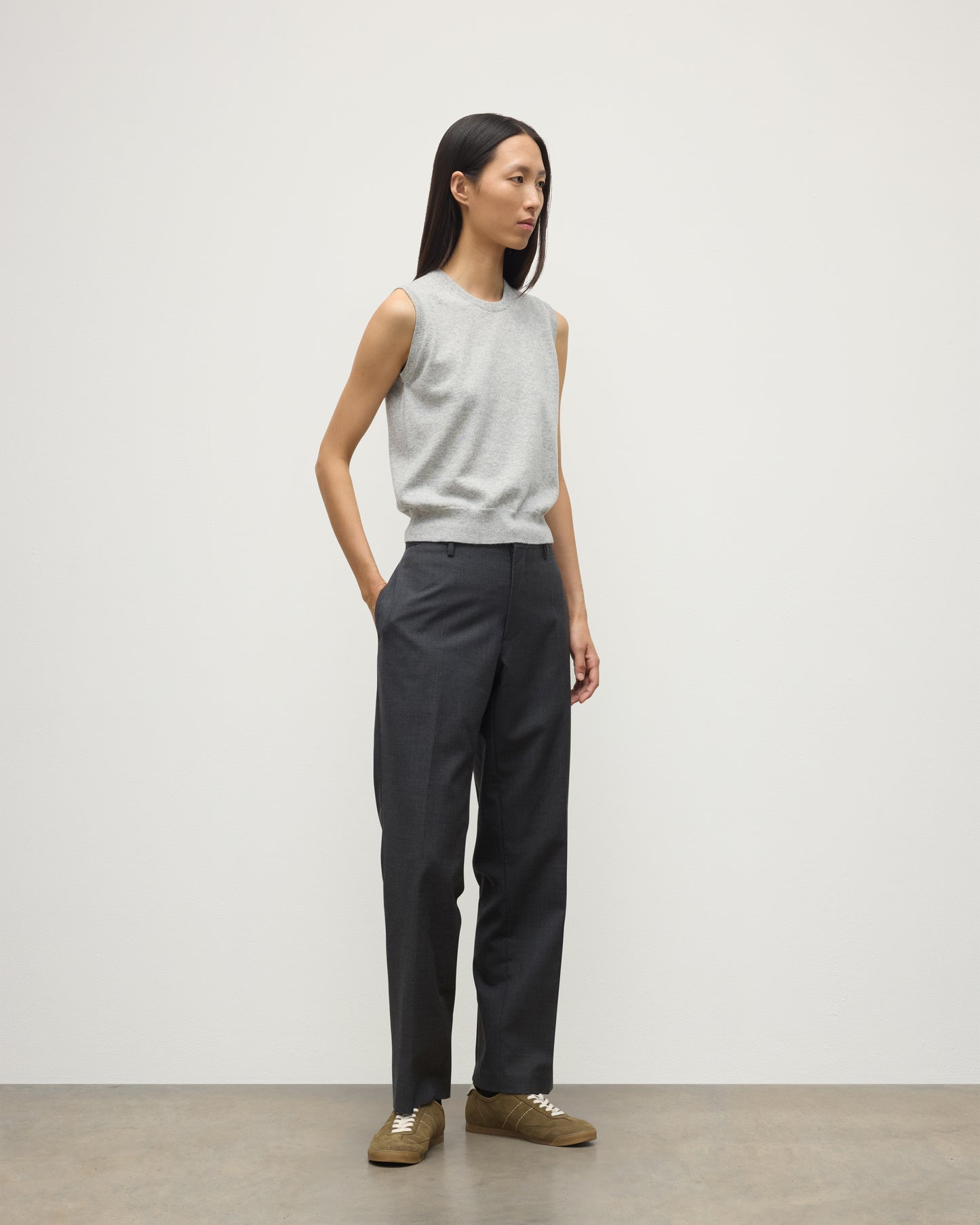 MODEL WEARS JOHNSTONS OF ELGIN WOMENS IRIS CLASSIC SLEEVELESS CREW GREY 100% CASHMERE WITH GREY TROUSERS KAP05705HA0399