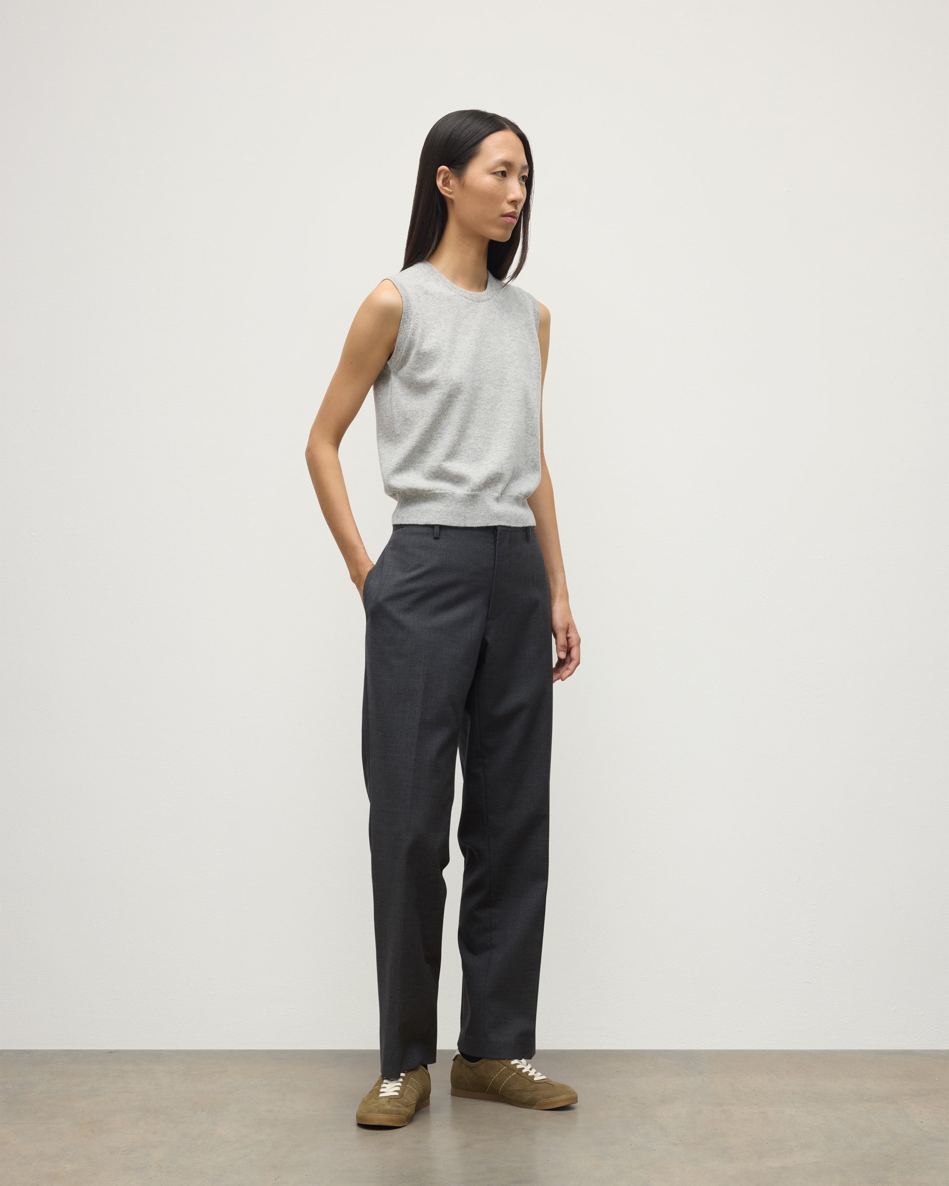 MODEL WEARS JOHNSTONS OF ELGIN WOMENS IRIS CLASSIC SLEEVELESS CREW GREY 100% CASHMERE WITH GREY TROUSERS KAP05705HA0399