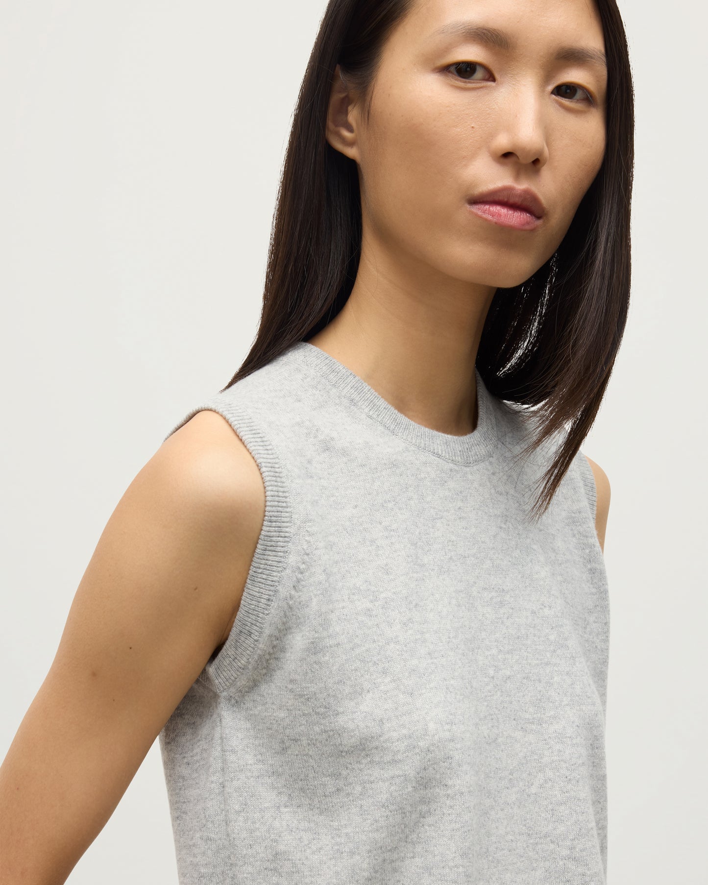 MODEL WEARS JOHNSTONS OF ELGIN WOMENS IRIS CLASSIC SLEEVELESS CREW GREY 100% CASHMERE KAP05705HA0399