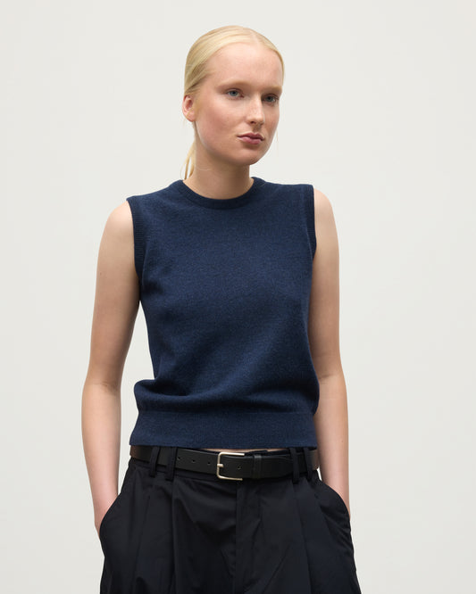 MODEL WEARS JOHNSTONS OF ELGIN WOMENS IRIS CLASSIC SLEEVELESS CREW NAVY 100% CASHMERE KAP05705HD7350