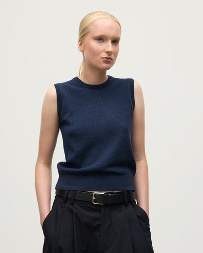 MODEL WEARS JOHNSTONS OF ELGIN WOMENS IRIS CLASSIC SLEEVELESS CREW NAVY 100% CASHMERE KAP05705HD7350